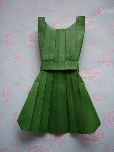 an origami dress made out of green paper