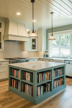 a kitchen island with bookshelves in the middle