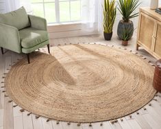 a living room with a chair and rug on the floor