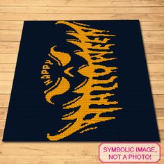 a rug with the image of a man's face in yellow and black on it