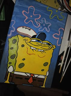 a painting of a spongebob wearing a hat and tie with other items in the background