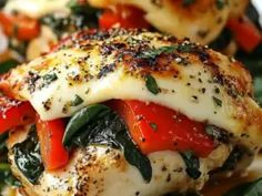 chicken with tomatoes, spinach and cheese on a plate