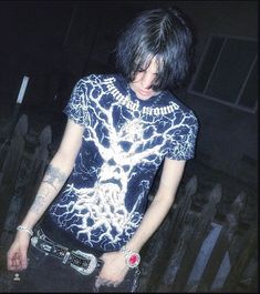 a young man with black hair and lightning shirt