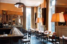 an empty restaurant with many tables and chairs