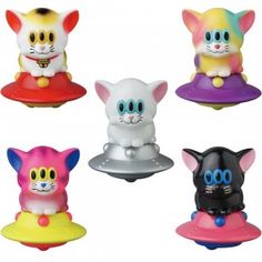 six different colored cat toys sitting on top of each other