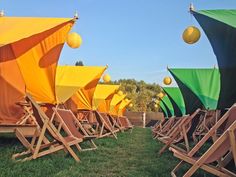 rows of lawn chairs with colorful covers on them