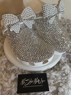 MyStyleMyWay's  custom crocs are designed for the perfect outfit, that special occasion, and "Just Because" you love blinged out crocs.  In the display shown we designed a pair of white classic crocs adding high quality silver rhinestones. 🎀 Each Rhinestone is individually and neatly placed to achieve the design.  🎀Rhinestones are added to the top portion of the shoe 🎀Bows are applied to the sports mode strap to this design to add cuteness and personality.  🎀This design do not have charms, charms can be added please contact us directly.  🎀When making your purchase - You're making a purchase for the exact style shown. If you would like a different color rhinestone,  and or different charms please message us so we can assist you. We're committed to the uniqueness in your purchase; there White Rhinestone Custom Sneakers For Streetwear, Luxury White Custom Sneakers With Rhinestones, White Custom Sneakers With Bling, Round Toe, Luxury Rhinestone Lace-up Custom Sneakers, Customized Diamond Crocs Shoes, Bling Bows, Bedazzled Shoes, Rhinestone Projects, Bling Shoes