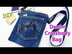 the denim cross body bag is on display with other items around it, including a cell phone