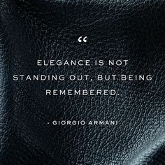 a black leather texture with the quote elegance is not standing out, but being remembered