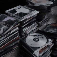 many cds stacked on top of each other