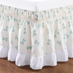 a bed skirt with butterflies on it