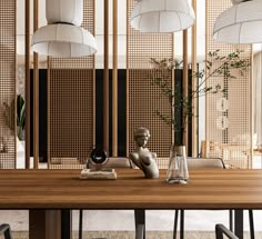 a wooden table with chairs and vases on it in front of bamboo screen dividers