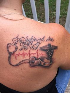 a woman with a stethoscope tattoo on her back shoulder and the words she beled she could so she did