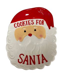 a ceramic santa clause ornament with cookies for santa written on the front and bottom