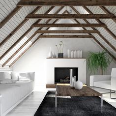 an attic living room with white furniture and wood beams on the ceiling, along with a black area rug