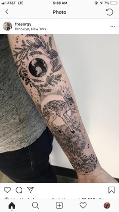 a person with a tattoo on their arm and the other hand is holding a camera