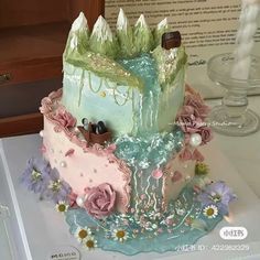 there is a cake that looks like it has been made to look like a castle