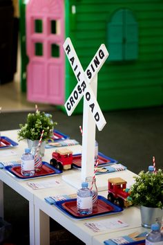 the table is set up with plates and place settings for children's birthday party