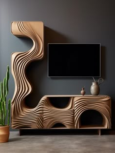 a modern wooden entertainment center with a large screen