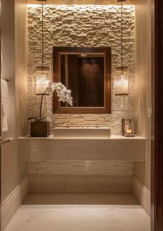 an elegant bathroom with stone walls and flooring