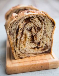 a loaf of cinnamon swirl bread on a cutting board