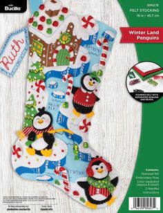 a christmas stocking with penguins on it