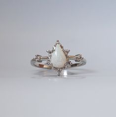 Celestial White 14k Gold Rings, Elegant Silver Opal Stackable Rings, Diamond White Teardrop Ring For Promise, 14k Gold Halo Design Jewelry For Promise, Fine Jewelry Teardrop Stackable Rings, Fine Jewelry Stackable Teardrop Ring, Celestial 14k Gold Opal Wedding Ring, 14k Gold Teardrop Jewelry For Promise, White Gold Teardrop Promise Jewelry