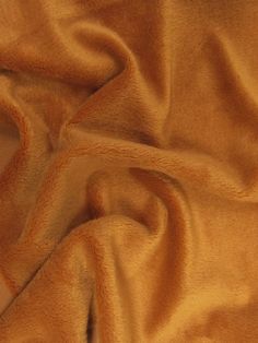 a close up view of a tan colored fabric