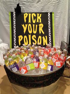 a bucket filled with lots of different types of soda bottles and plastic bags next to a sign that says pick your poson