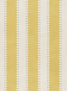 a yellow and white striped wallpaper with blue dots