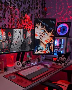 three computer monitors sitting on top of a desk next to a keyboard and monitor screen