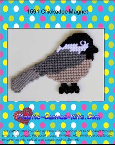 a crocheted bird sitting on top of a blue and white polka dot background