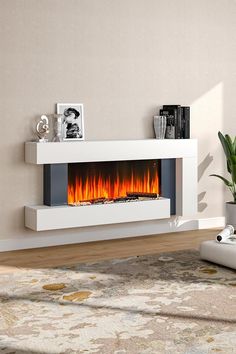 This is an elegant piece of heating appliance. The appearance is designed in a minimal way, with the white wooden frame, the simple appearance can add a touch of contemporary to any room. You deserve a cosy winter, and this fireplace provides you with constant heat yet without bringing any smoke or odor. Heat up your room in style with this fireplace! Electronic Fireplace Ideas, Surround Fireplace, House Refurbishment, Electric Fire Suites, Recessed Electric Fireplace, Electric Fireplace Wall, Hotel Lobbies, Black Fireplace, Electric Fireplaces