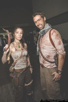 a man and woman dressed up as zombies