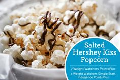 salted hershey kiss popcorn in a white bowl with chocolate drizzle on top