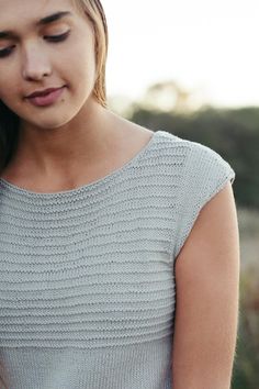 a close up of a person wearing a sweater