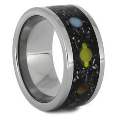 an artisticly designed ring with planets and stars inlayed to it's surface