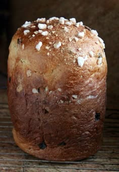 a loaf of bread sitting on top of a cooling rack