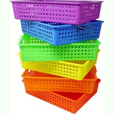 four plastic baskets stacked on top of each other