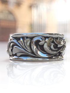 a silver ring sitting on top of a table