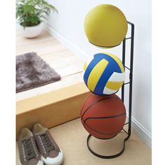 three balls stacked on top of each other with the words ball stand frame above them