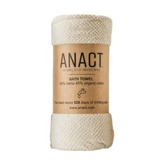 a roll of bath towel sitting on top of a white surface with the words anact written