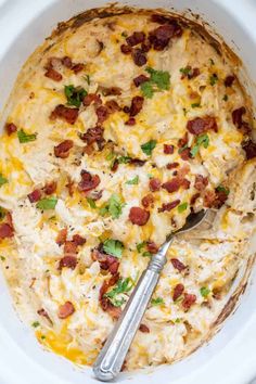 a casserole dish with chicken, bacon and cheese in it on a white plate