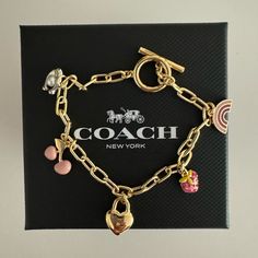 Nwot No Box 5 Charms *Gold Plated* Paper Clip Gold Plated Chains With 5 Charms Toggle Clasp Rare Charm Bracelet By Coach Bracelets Charms, Coach Bracelets, Luxury Gold Bracelet With Vintage Charm, Vintage Gold Charm Bracelet With Heart Charm, Vintage Gold Charm Bracelet Luxury, Vintage Gold Charm Bracelet Collectible, Luxury Gold Antique-style Charm Bracelet, Custom Charm Bracelet, Coach Jewelry