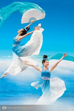 two women in blue and white dresses are holding parasols while standing on the beach