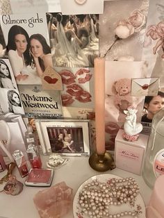 a table topped with pink and white items