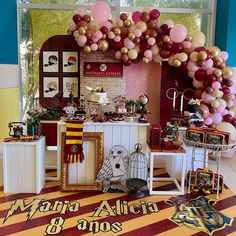 a room with balloons and decorations on the wall