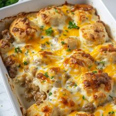 a casserole dish with meatballs and cheese