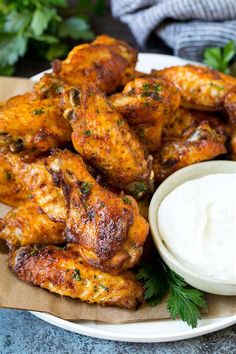 chicken wings with ranch dressing on a plate