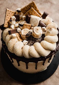 a cake covered in chocolate and marshmallows on top of a countertop